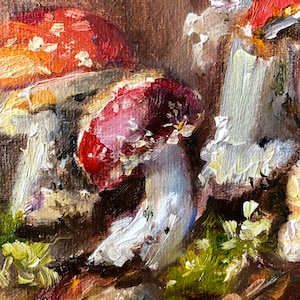 K&ouml;nnte beinhalten: Nahaufnahme von drei roten und wei&szlig;en Pilzen mit wei&szlig;en Stielen, im impressionistischen Stil auf braunem Hintergrund gemalt.