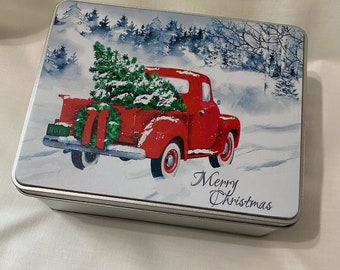 Christmas tin gift set. Printed Christmas snow scene on gift tin. Set includes printed tin, cotton tea towel and cotton dish cloth.