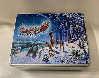 Christmas tin gift set. Printed Christmas snow scene on gift tin. Set includes printed tin, cotton tea towel and cotton dish cloth.