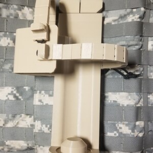 Holder / holster for HK M320 40mm grenade launcher or airsoft replica 3d printed in desert tan  PETG