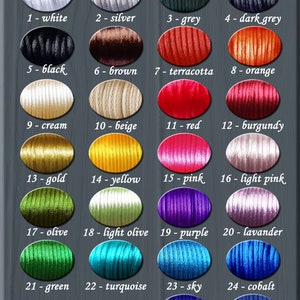 May include: Color palette chart with 26 different colors of embroidery floss. The colors are arranged in rows and labeled with numbers and names. The chart is titled "Color palette" and "Workshop Bad Wolf".