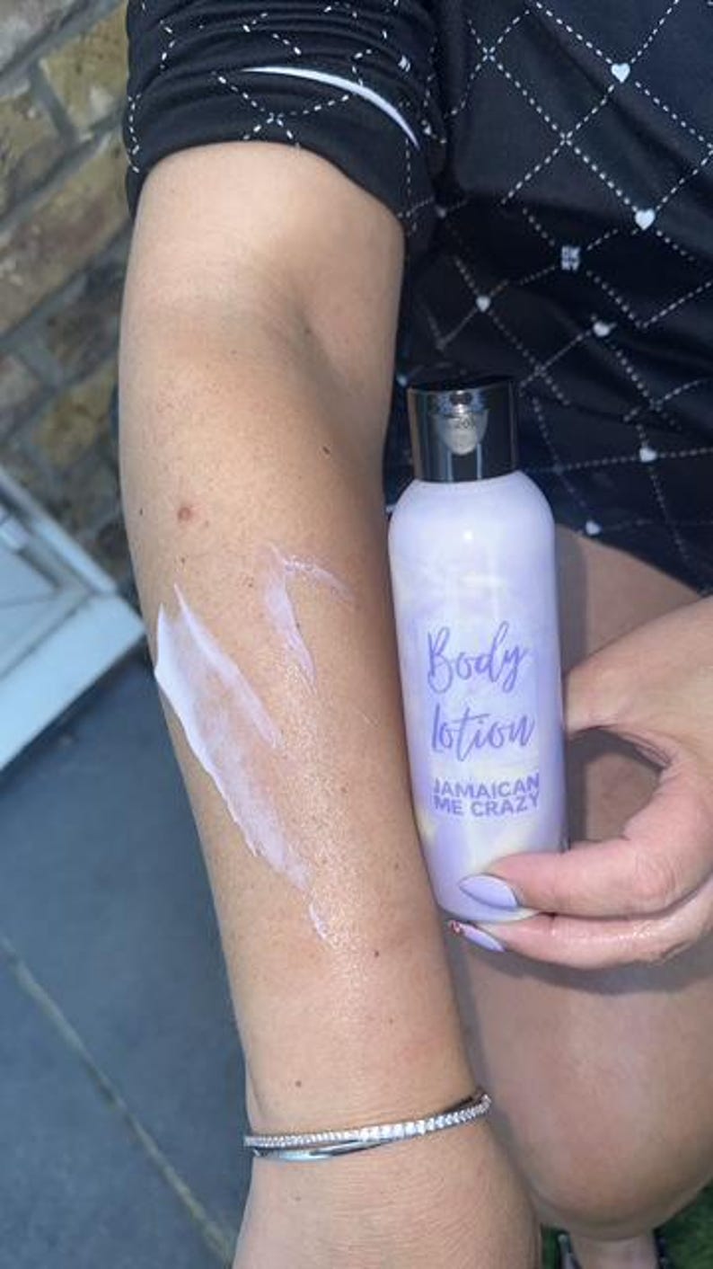 May include: A purple bottle of body lotion with the text "Body lotion Jamaican Me Crazy" on the label.
