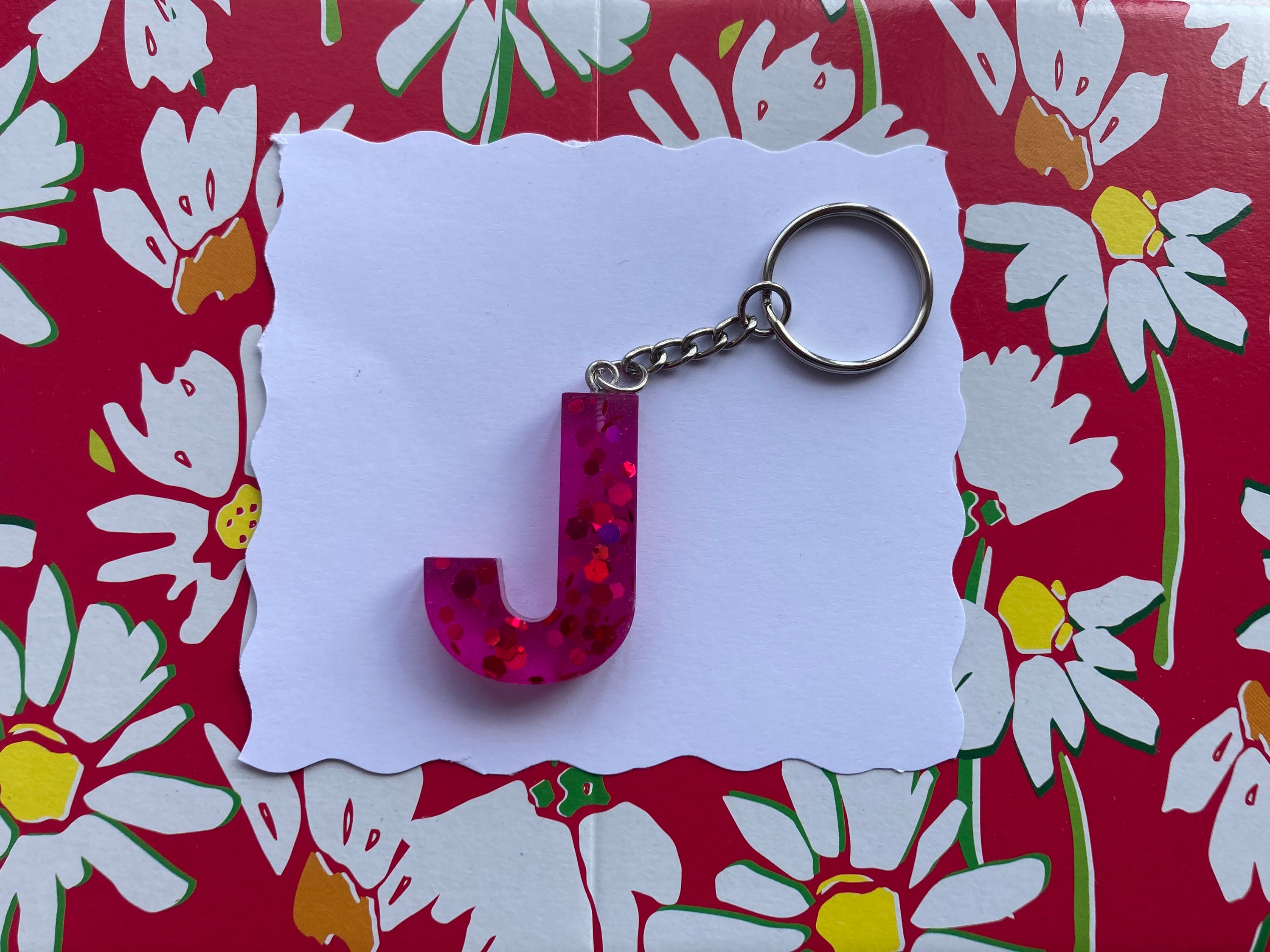 Letter J pink background and pink glitter resin keyring. Etsy