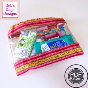 May include: A clear plastic zippered pouch with a pink and yellow floral patterned fabric exterior. The pouch is filled with various travel-sized toiletries, including hand sanitizer, lotion, and tissues.