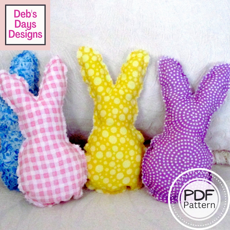 May include: Three Easter bunny plush toys, one pink and white gingham, one yellow with white polka dots, and one purple with white polka dots. The toys are sitting on a white surface. The text "PDF Pattern" is visible in the lower right corner of the image.