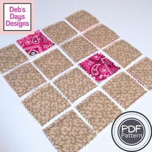 May include: An arrangement of square fabric patches, mainly tan with a textured pattern, with pink paisley squares. The patches have a scalloped edge. The image includes the text "Deb's Days Designs" and a "PDF Pattern" logo.