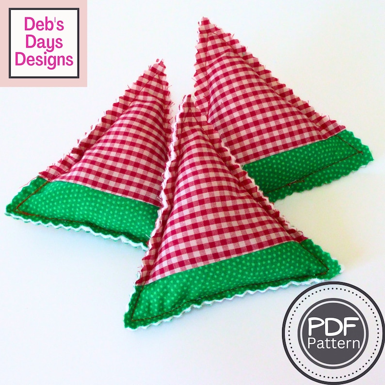 May include: Three red and white gingham fabric triangle pillows with green polka dot fabric trim. The pillows are sewn with a white zig-zag stitch. The text "PDF Pattern" is in a circle on the bottom right of the image.