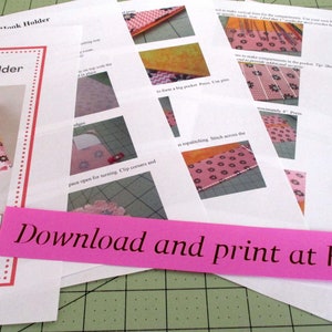 May include: A set of instructions for making a crochet hook holder. The instructions are printed on white paper and include photos of the finished product. The instructions are titled "Crochet Hook Holder" and include the text "Download and print at home".