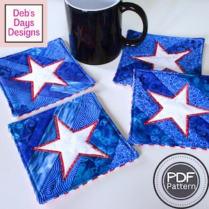 May include: Four blue and white fabric coasters with a white star in the center. The coasters have a red and white trim. The coasters are sitting on a white surface. The text "PDF Pattern" is in a circle on the bottom right of the image.