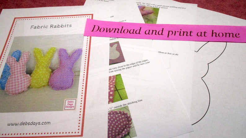 May include: A printable pattern for making fabric rabbits. The pattern includes instructions for sewing the fabric pieces together and a template for the rabbit's ears. The text on the page reads "Fabric Rabbits" and "Download and print at home".