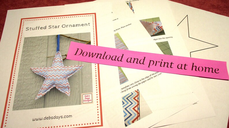 May include: A printable pattern for a stuffed star ornament. The pattern includes instructions for sewing the star and a template for cutting out the fabric. The finished ornament is red, white, and blue with a chevron pattern.