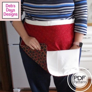 May include: A red and white apron with a large pocket and a smaller pocket on the side. The apron has a white polka dot pattern on the red fabric. The text "PDF Pattern" is visible in the lower right corner of the image.