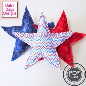 May include: Three star-shaped fabric pillows in red, blue, and white with a chevron pattern. The pillows are sewn with a scalloped edge. The text "PDF Pattern" is visible in a circle on the bottom right of the image.