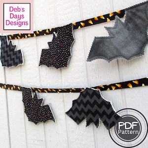 May include: A Halloween banner with black bats made from fabric with different patterns. The bats are strung together with black and orange ribbon. The text "PDF Pattern" is visible in the lower right corner of the image.