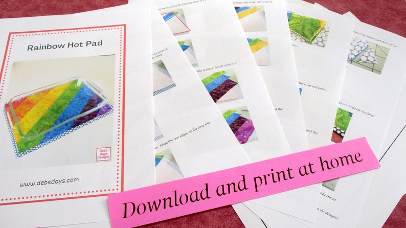 May include: A set of printable instructions for making a rainbow hot pad. The instructions include photos and text. The text on the pink paper reads "Download and print at home".