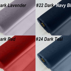 May include: Four rolls of fabric in different colours: dark lavender, dark navy blue, dark red, and dark teal. Each roll is labelled with a number and colour name.