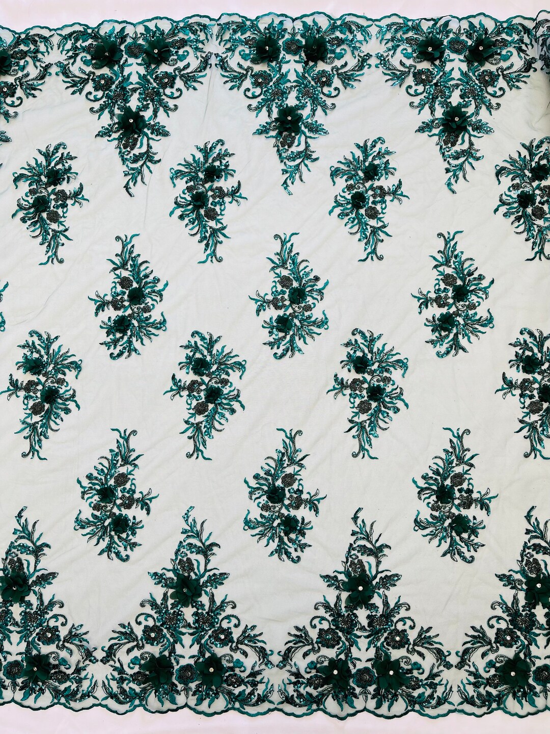 Hunter Green diva design embroidery with heavy beaded on a mesh lace-sold by the yard.