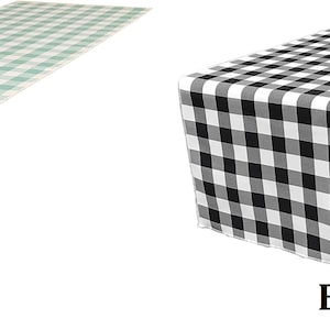 May include: Two table runners, one aqua and one black, with a checkered pattern.