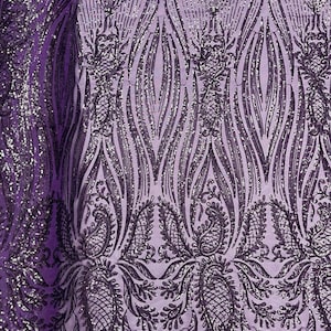May include: Purple sequined fabric with a paisley pattern. The sequins are silver and the fabric has a mesh backing.
