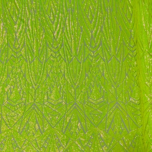 Puede incluir: Tela verde lima con un patrón geométrico de lentejuelas. Las lentejuelas están dispuestas en un patrón repetitivo de líneas verticales y triángulos.
