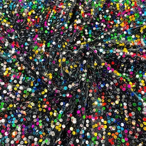 May include: Black fabric with a rainbow of sequins. The sequins are small and round, and they are arranged in a random pattern.