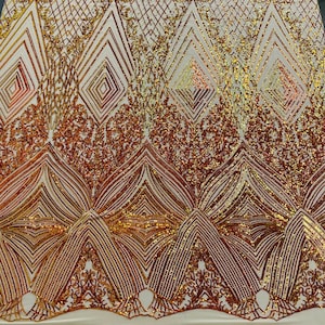 May include: Gold and copper sequined fabric with a geometric pattern. The fabric has a sheer mesh backing.