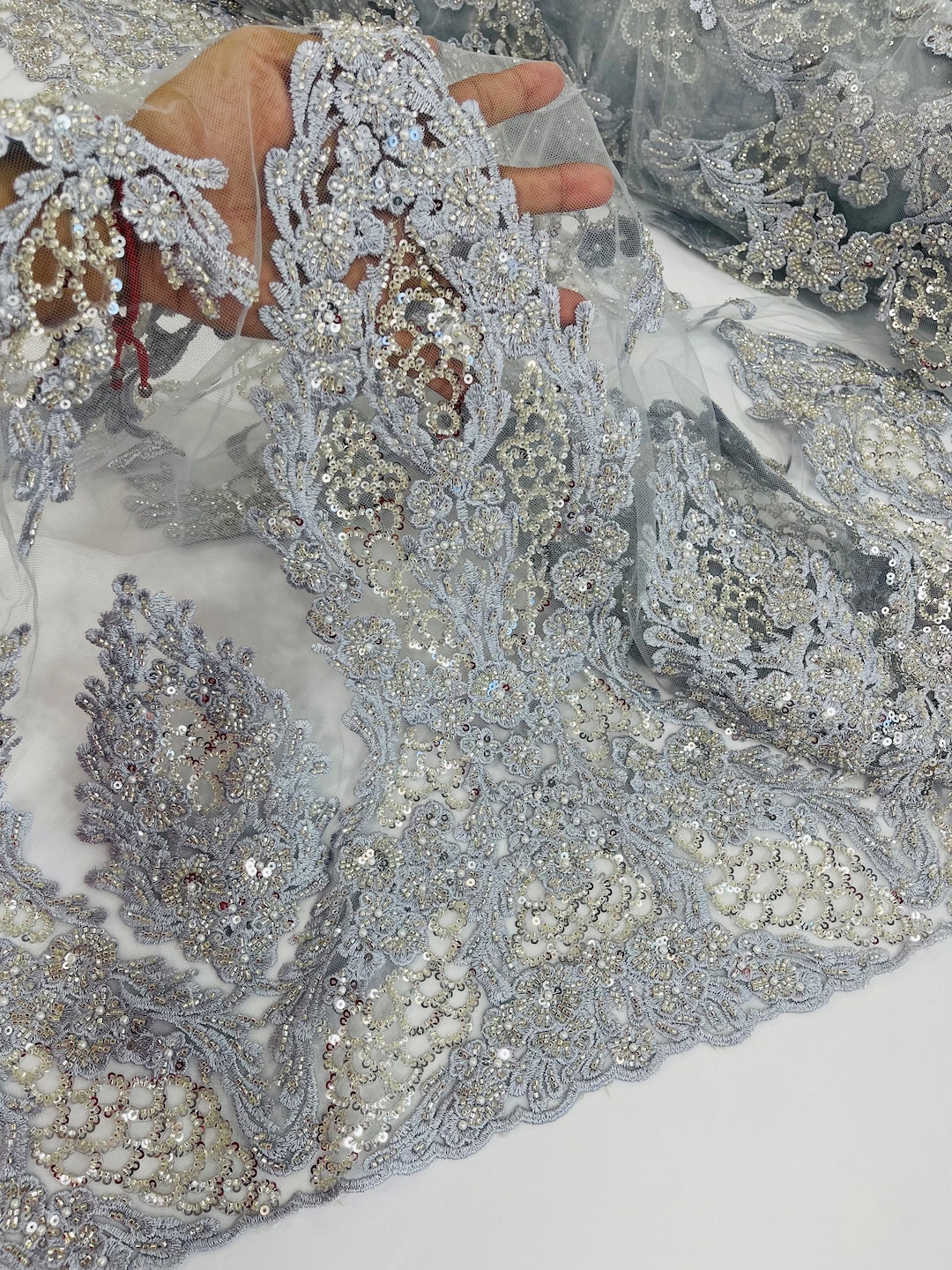 Metallic silver diva design embroidery with heavy beaded on a mesh lace-sold by the yard. main image 1