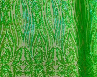 May include: Green iridescent sequins on a mesh fabric with a paisley pattern.