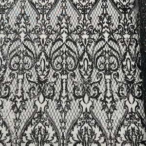 Zwarte stof met pailletten: geborduurd damast in vier richtingen stretch, kant van galajurk