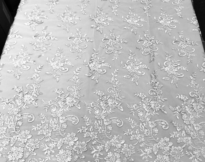White Flower Lace Fabric - Floral Clusters Embroidered With sequins on a Mesh Lace Fabric Sold By The Yard