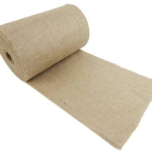 May include: A roll of natural brown burlap fabric. The fabric is woven and has a rough texture.