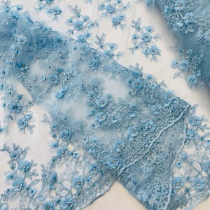 PEACH 3D FLORAL DESIGN EMBROIDERY AND BEADED WITH RHINESTONES ON A MESH LACE.