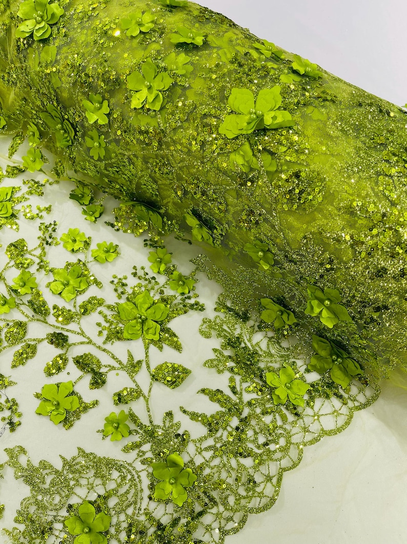 May include: Green floral lace fabric with 3D flowers and glitter. The fabric has a delicate mesh base and is perfect for adding a touch of elegance to any project.
