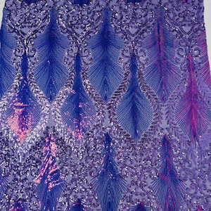 May include: Purple and blue iridescent sequins on a mesh fabric with a feather design.