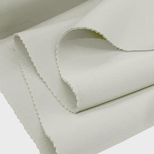 Ivory Scuba Knit Fabric: Polyester Spandex Blend - Sold By The Yard