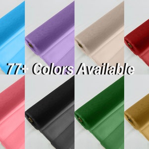 May include: A variety of colours of fabric rolls, including light blue, lavender, beige, red, pink, black, green, and gold. The text "77+ Colours Available" is displayed in the centre of the image.