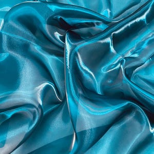 Tissu organza liquide bleu canard : organza transparent brillant, cristal réfléchissant, 60 po. de large par mètre