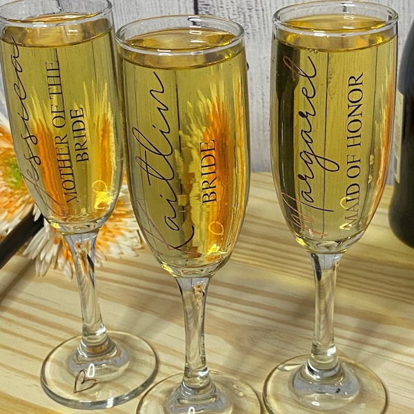 Custom Champagne flutes / champagne glasses for every occasion! Bridal Showers. Bachelorette Parties. Weddings. Family parties. Bridesmaid