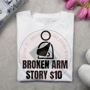 May include: White t-shirt with a black graphic of a person with a broken arm and the text "BROKEN ARM STORY $10".