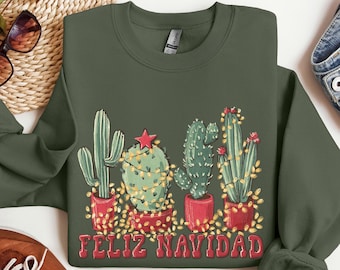 May include: A green sweatshirt with a Christmas cactus design and the text "Feliz Navidad".