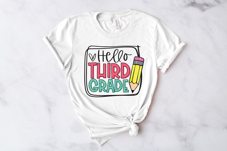 May include: White t-shirt with a graphic design that says "Hello Third Grade" with a pencil illustration.