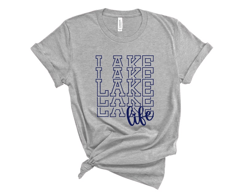 May include: Gray t-shirt with a navy blue graphic that says "I  LAKE life" with the word "LAKE" repeated multiple times.