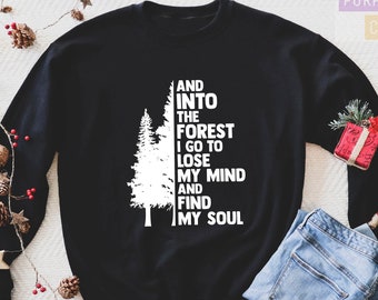 May include: Black sweatshirt with a white graphic of a pine tree and the text "AND INTO THE FOREST I GO TO LOSE MY MIND AND FIND MY SOUL".