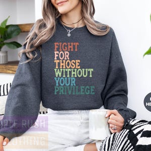 a woman sitting on a couch holding a coffee mug