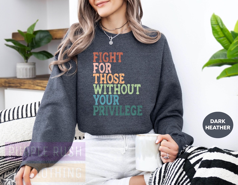 a woman sitting on a couch holding a coffee mug