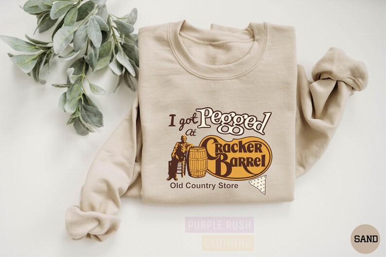 a t - shirt with a picture of an old country store on it