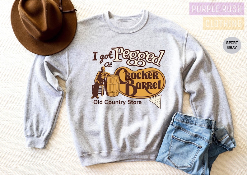 a sweater with a cowboy hat on top of it
