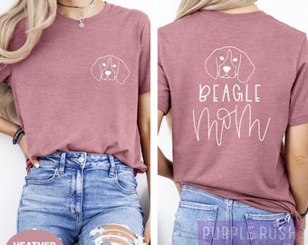 May include: A heather mauve t-shirt with a white outline of a beagle dog on the front and the text "BEAGLE MOM" on the back.