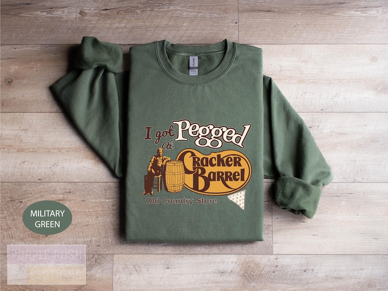a green shirt with a picture of a man on it