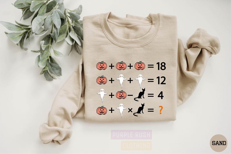 a t - shirt with a pumpkin and ghost addition on it